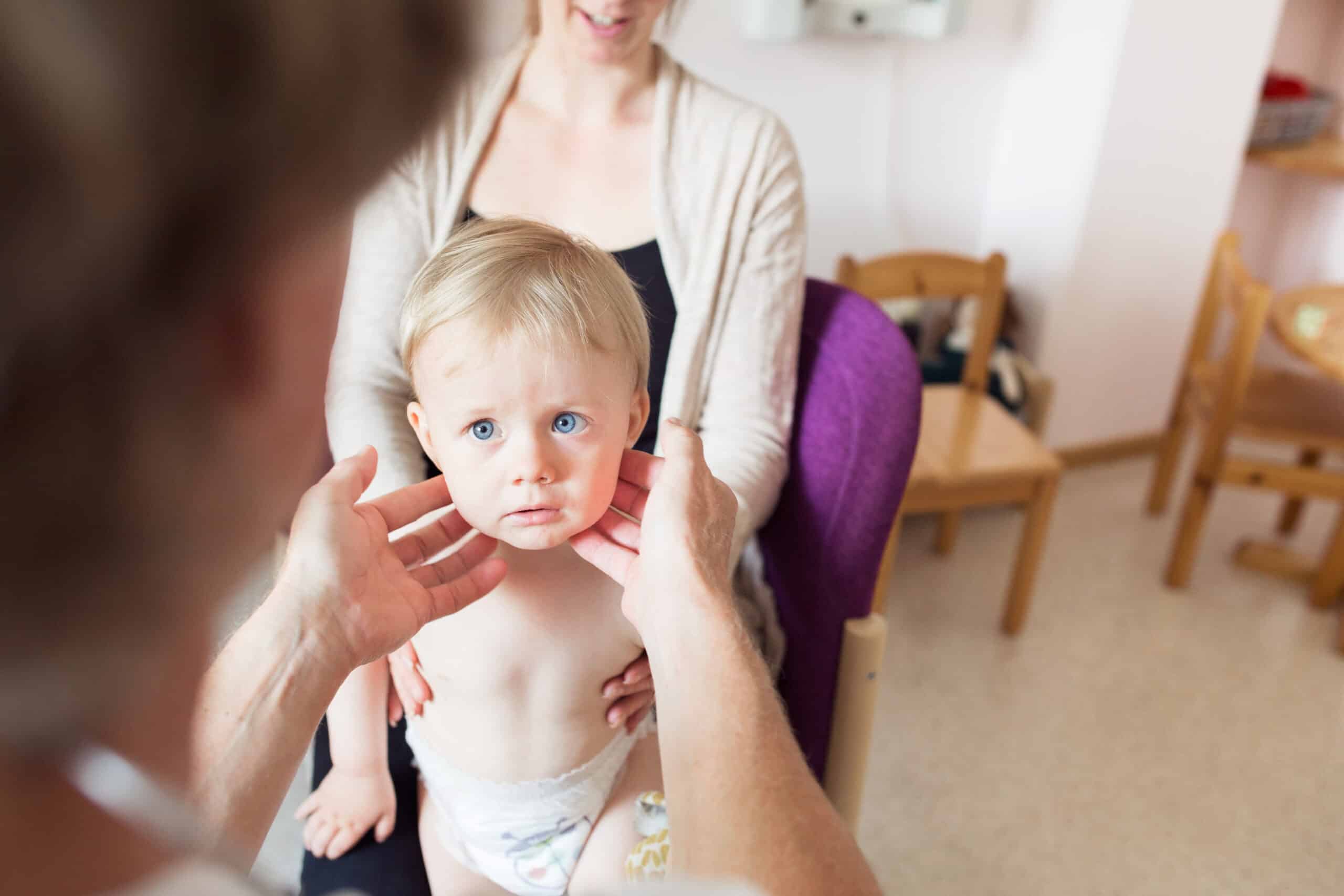 Doctor examining baby (12-17 months)